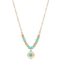 Collana dorata con ciondolo evil eye ed elementi in turchese