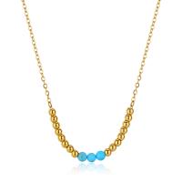 Collana dorata serie Glint con sferette in turchese